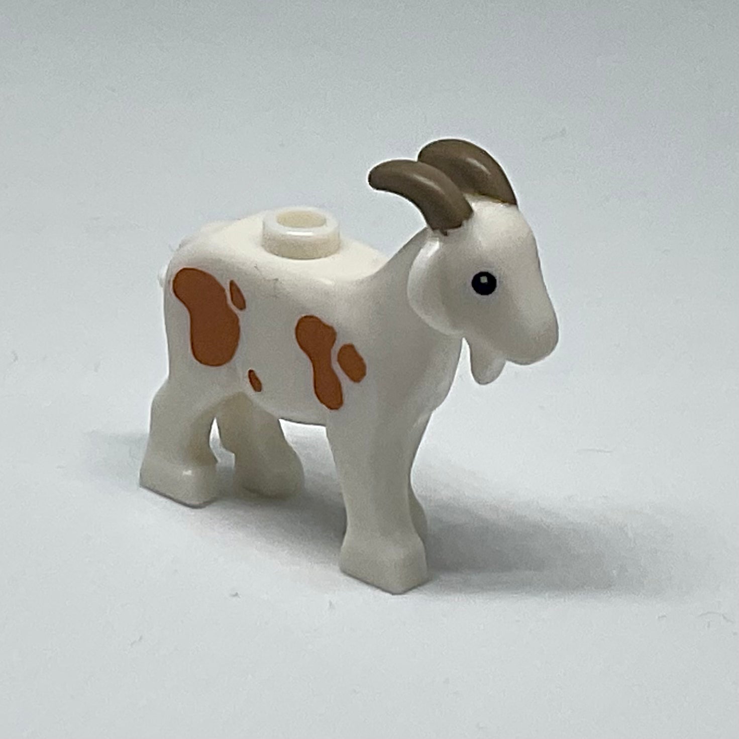 Goat with Black Eyes, Dark Tan Horns and Medium Nougat Spots Pattern